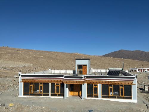 a building in the middle of a mountain at Bukpa Retreat - Pangong in Man
