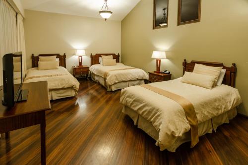 Ένα ή περισσότερα κρεβάτια σε δωμάτιο στο Hotel Spa Casa Real