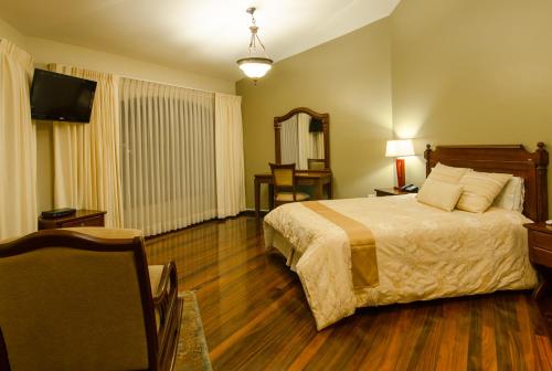 Ένα ή περισσότερα κρεβάτια σε δωμάτιο στο Hotel Spa Casa Real