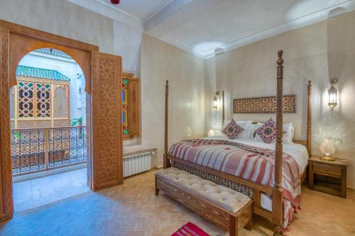 a bedroom with a bed and a window in a room at Palais Tara & Spa in Marrakech