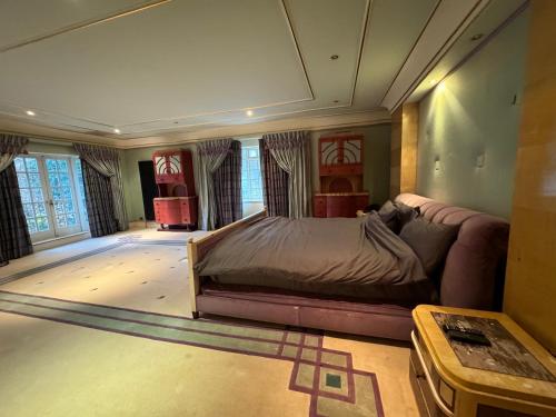 a bedroom with a bed and a couch at The Bishop in London
