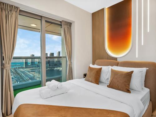 a bedroom with a bed and a large window at SKY HIGH 2 BHK # Ain Dubai & Sea View # Marina & JBR in Dubai