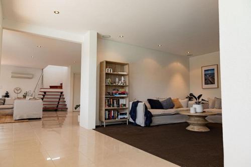 a living room with a couch and a table at Heated magnesium pool, MTB, family & dog friendly in St Helens