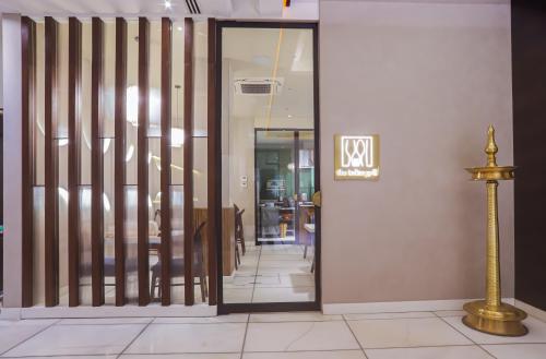 a lobby with a door and a sign on a wall at Hotel Godwin Deluxe - Free Airport Pick-Up in New Delhi