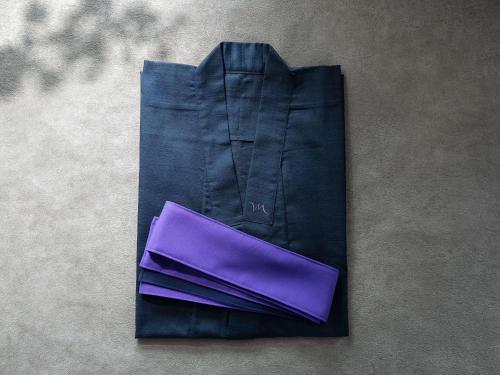 a black suit with a purple case on a table at Mercure Wakayama Kushimoto Resort & Spa in Kushimoto