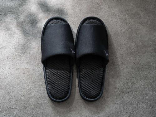 a pair of black shoes sitting on a carpet at Mercure Wakayama Kushimoto Resort & Spa in Kushimoto