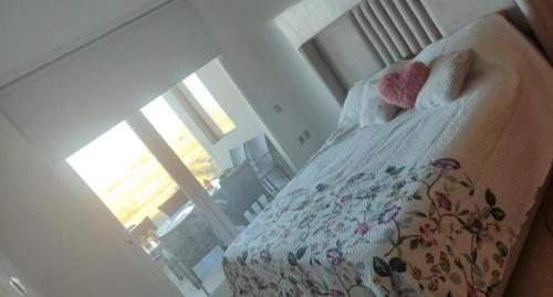 a bedroom with a bed with towels on it at appartment &Roof top duplex with solarium in Bouznika