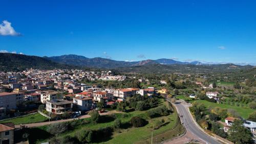 an aerial view of a city with mountains in the background at Residence Stella Dell'Est in Bari Sardo