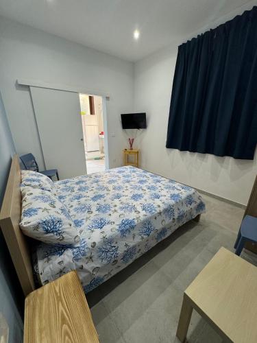 Ένα ή περισσότερα κρεβάτια σε δωμάτιο στο Angú - Casa Vacanze
