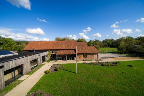 an overhead view of a building with a grass yard at Barabois luxury vacation home in Ronse
