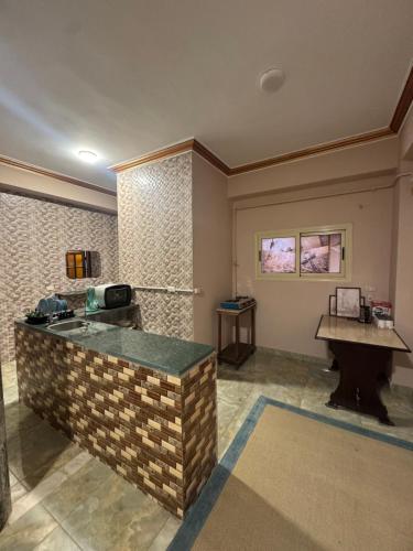 a waiting room with a counter and a table at King Soliman Villa in Cairo
