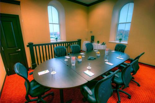 a conference room with a table and chairs at Courtyard by Marriott Waterloo St. Jacobs in Waterloo