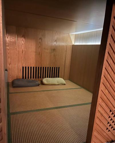 a small room with a bed in a wall at 夜色V8s in Kampong Alor Gajah