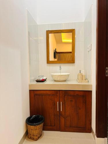 a bathroom with a sink and a mirror at South Hill Pandawa in Nusa Dua