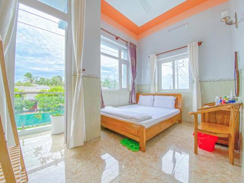Postel nebo postele na pokoji v ubytování La Min Hotel - Đảo Phú Quý
