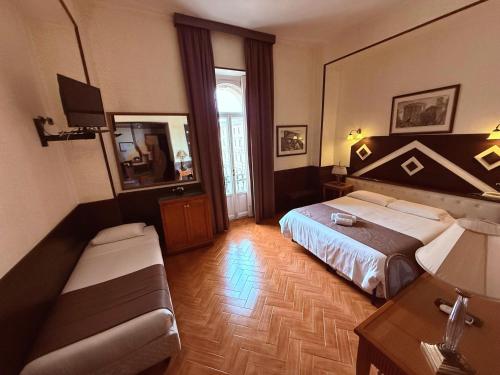 Postel nebo postele na pokoji v ubytování Hotel Nardizzi Americana