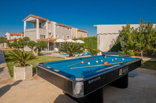 a pool table in front of a house at Villa Shameti - Private Villa with Pool and Billiards Near Zakynthos Town By Villa Mana Gers in Zakynthos Town