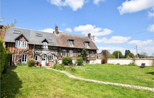 a large house with a green lawn in front of it at Pet Friendly Home In Le Mesnil-Esnard in Le Mesnil-Esnard