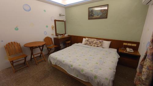 Cama o camas de una habitación en Umin Chu Inn