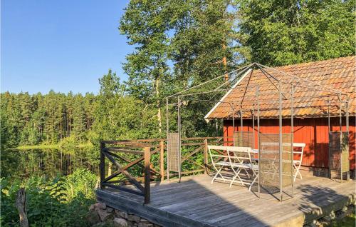 a wooden deck with a gazebo and a house at 2 Bedroom Amazing Home In Vimmerby in Vimmerby
