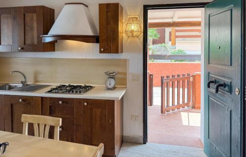 a kitchen with a sink and a stove top oven at 2 Bedroom Beautiful Home In Castelsardo in Castelsardo