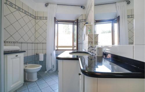 a bathroom with a sink and a toilet at Cozy Apartment In Montenero D'orcia in Montenero