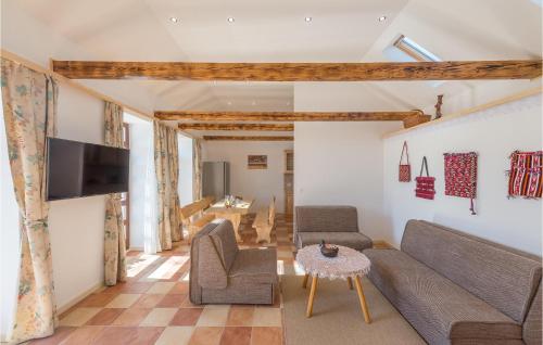 a living room with a couch and chairs and a tv at Four-Bedroom Holiday Home In Citluk in Čitluk