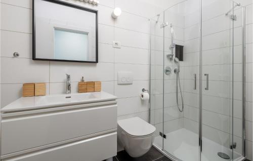 a bathroom with a shower and a toilet and a sink at Stunning Apartment In Mali Losinj in Mali Lošinj
