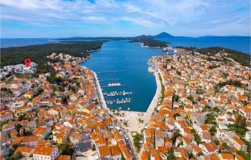 an aerial view of a city and a body of water at Stunning Apartment In Mali Losinj in Mali Lošinj