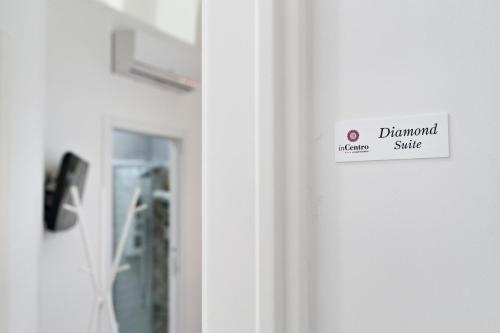 a close up of a door with a sign on it at InCentro Comfort Suite - Lecce Selection in Lecce