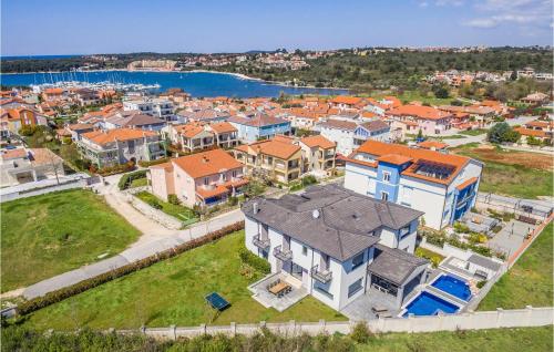 an aerial view of a city with houses at Beautiful Home In Banjole in Banjole