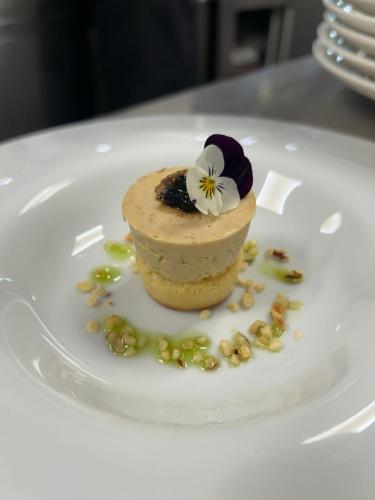a dessert on a white plate on a table at Miramare The Palace Resort in Sanremo