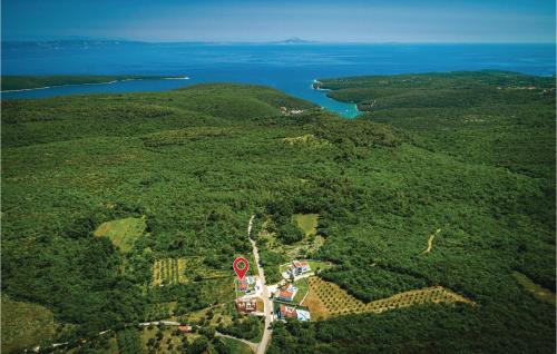 an aerial view of a house in the middle of a forest at Nice Home In Krnica With Jacuzzi in Krnica