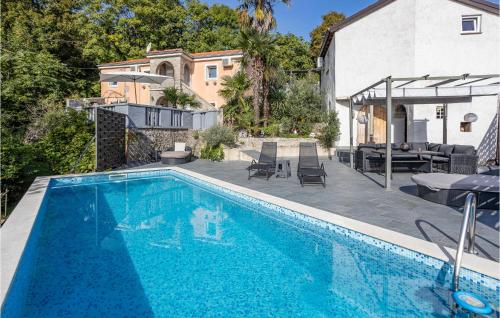 a swimming pool in front of a house at 2 Bedroom Stunning Home In Bregi in Breza