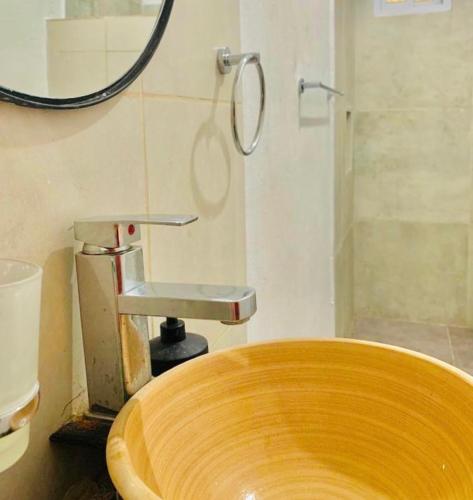 a wooden sink in a bathroom with a shower at Che Camba in Colonia Carlos Pellegrini