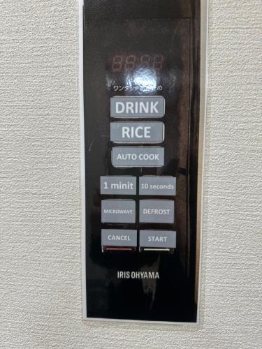 a picture of a remote control in a wall at MA House in Osaka