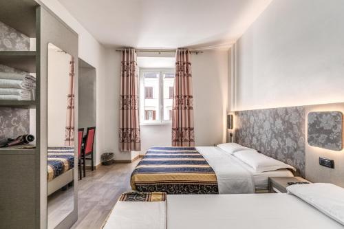 Postel nebo postele na pokoji v ubytování Hotel principe