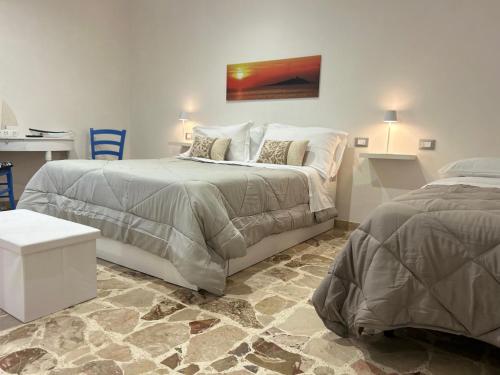 Ένα ή περισσότερα κρεβάτια σε δωμάτιο στο Hiera Favignana