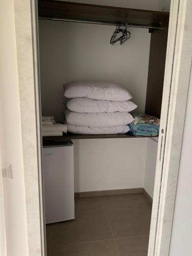a closet with a stack of towels on a shelf at Relais San Giovanni srls in Castellaneta
