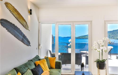 a living room with a couch and a view of the ocean at 3 Bedroom Nice Apartment In Marina in Marina