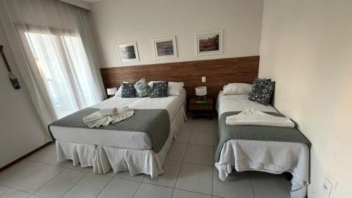 Postel nebo postele na pokoji v ubytování Apartamento em Resort Tree Bies