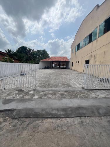 a building with a gate in front of it at Pousada Terra das Águas Barreirinhas in Barreirinhas