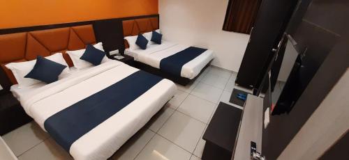 Postel nebo postele na pokoji v ubytování Hotel Sunview