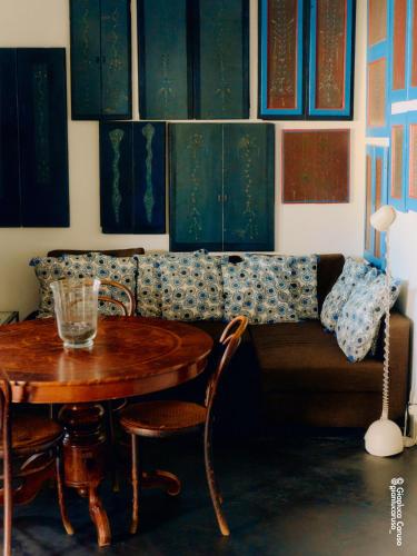 a living room with a table and a couch at Casa 34 Dicembre in Stromboli