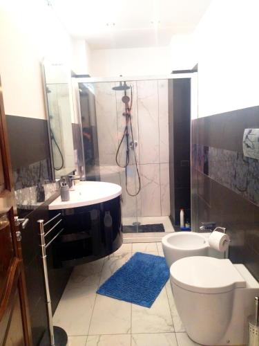 a bathroom with a shower and a toilet and a sink at CASA MARY in Menfi