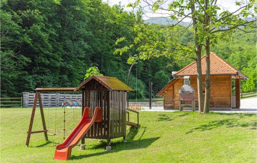 a playground with a slide and a play structure at Cozy Home In Vitesinec With Sauna in Salinovec