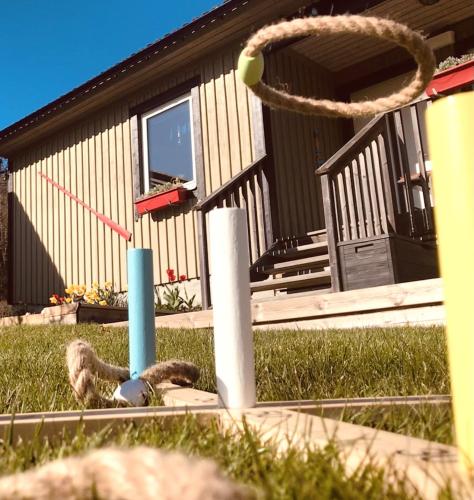 a ball is in the air in front of a house at Haere Mai B&B Orust in Henån
