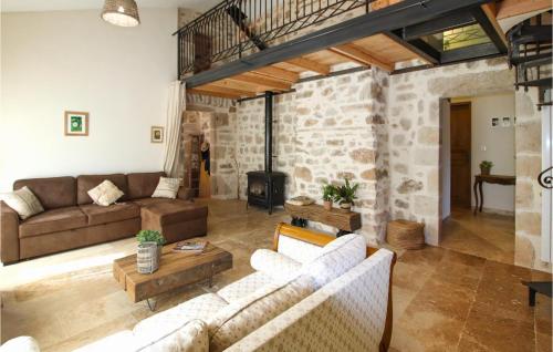 a living room with a couch and a fireplace at Beautiful Home In Banne in Banne