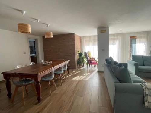 a living room with a wooden table and a couch at Residenza Sant'Angelo in Citta' Sant'Angelo