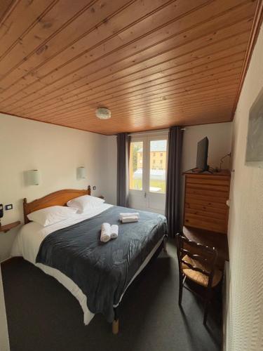 Postel nebo postele na pokoji v ubytování Hotel le Taillon
